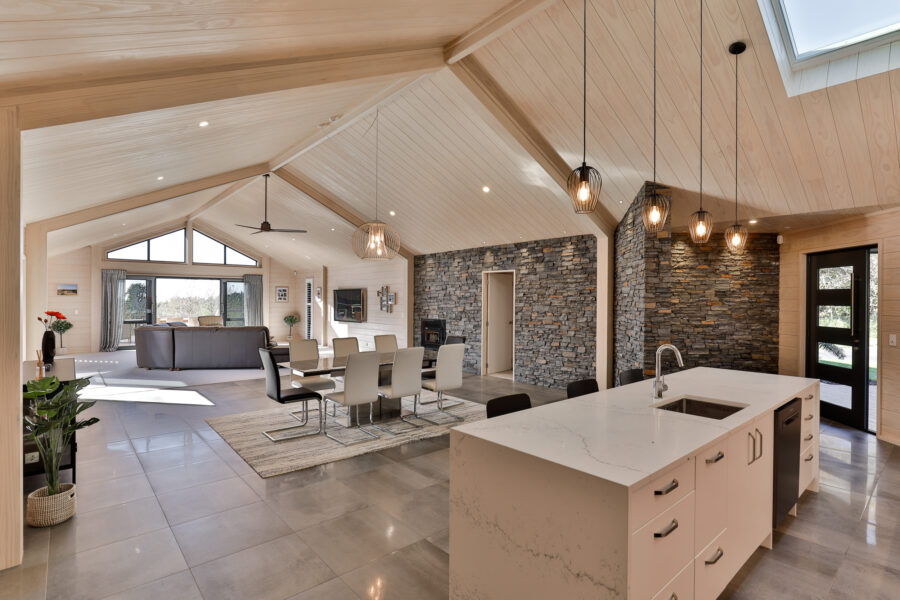 Lockwood home with schist stone wall in dining and living area